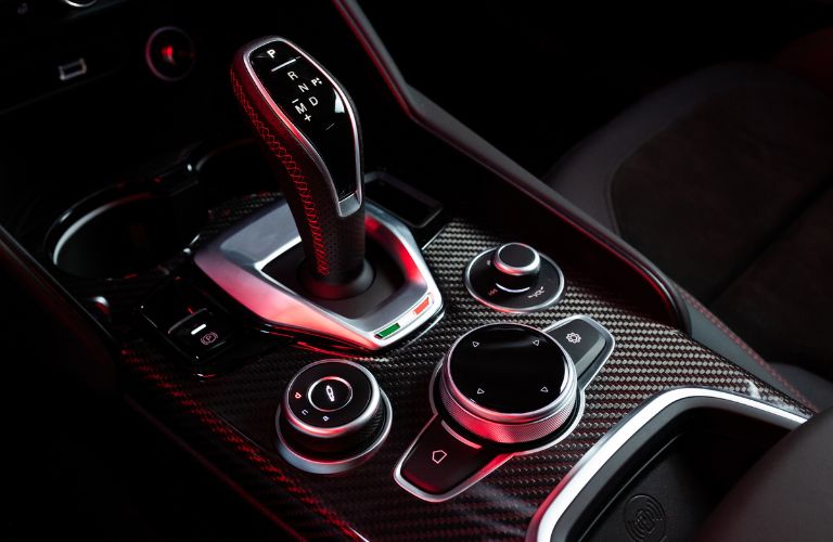 Close up view of the carbon fiber trim around the center console of the Alfa Romeo Stelvio Estrema